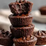 A plate of fudgy chocolate protein brownie bites with dark chocolate chips