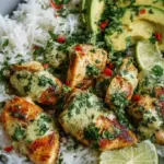 Sliced cilantro lime chicken breast over jasmine rice with fresh avocado slices