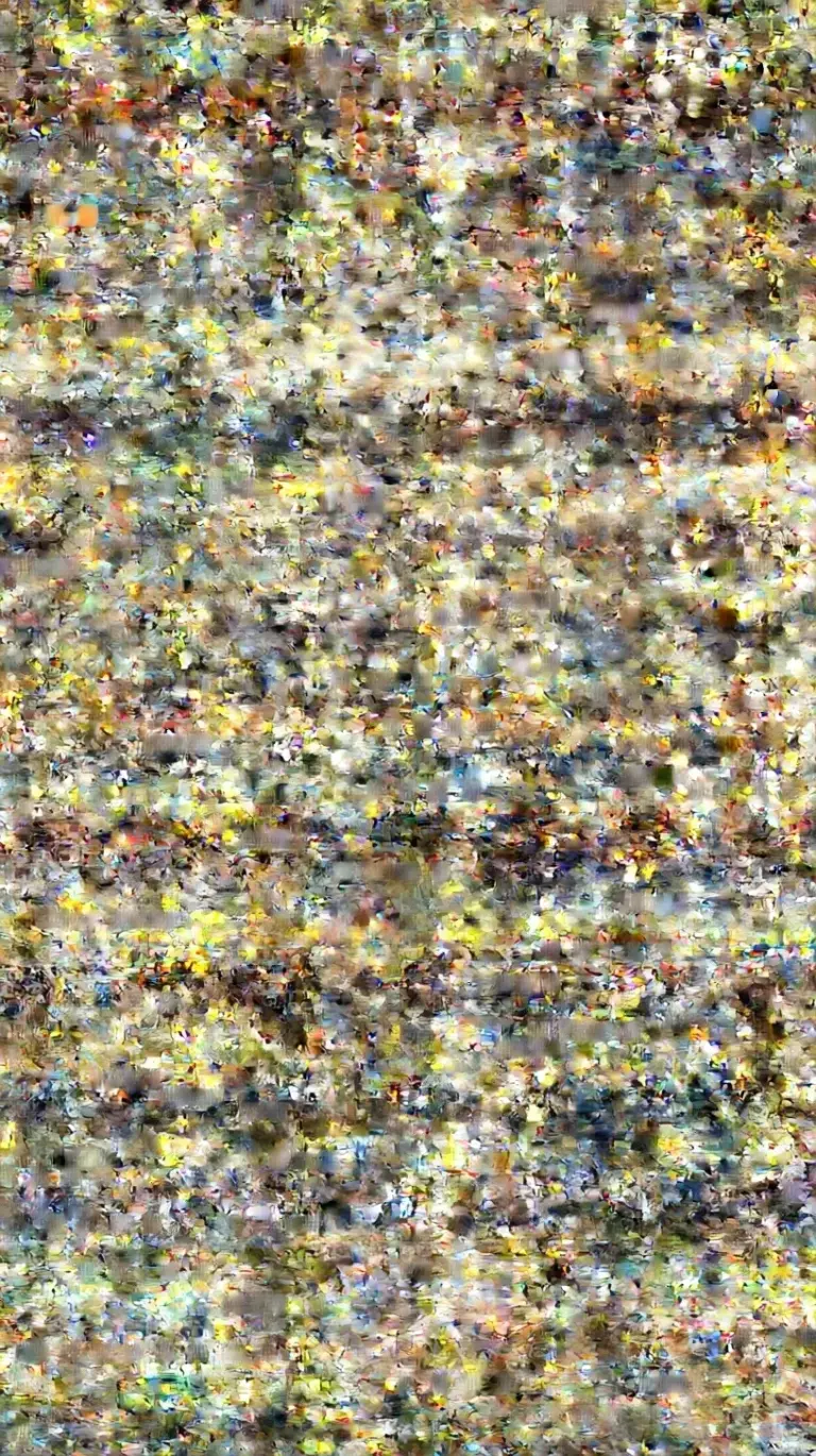 A top-down view of a golden Greek chicken lemon rice skillet with fresh herbs and lemon slices.