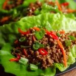 Savory ground beef in crisp butter lettuce cups with shredded carrots and green onions