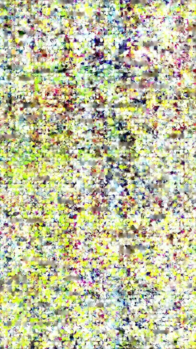 A row of four glass meal prep containers filled with kale, chickpeas, cucumbers, and grilled chicken cubes.