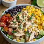 A fresh bowl of High Protein Southwest Chicken Salad with grilled chicken, avocado, and lime dressing.