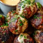 Golden baked beef meatballs glazed in a glossy red Korean BBQ sauce served with creamy spicy mayo.