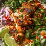 A vibrant Sweet Chili Chicken Bowl with jasmine rice, steamed broccoli, and a creamy white drizzle.